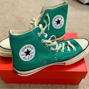 Converse Green high top sneakers.